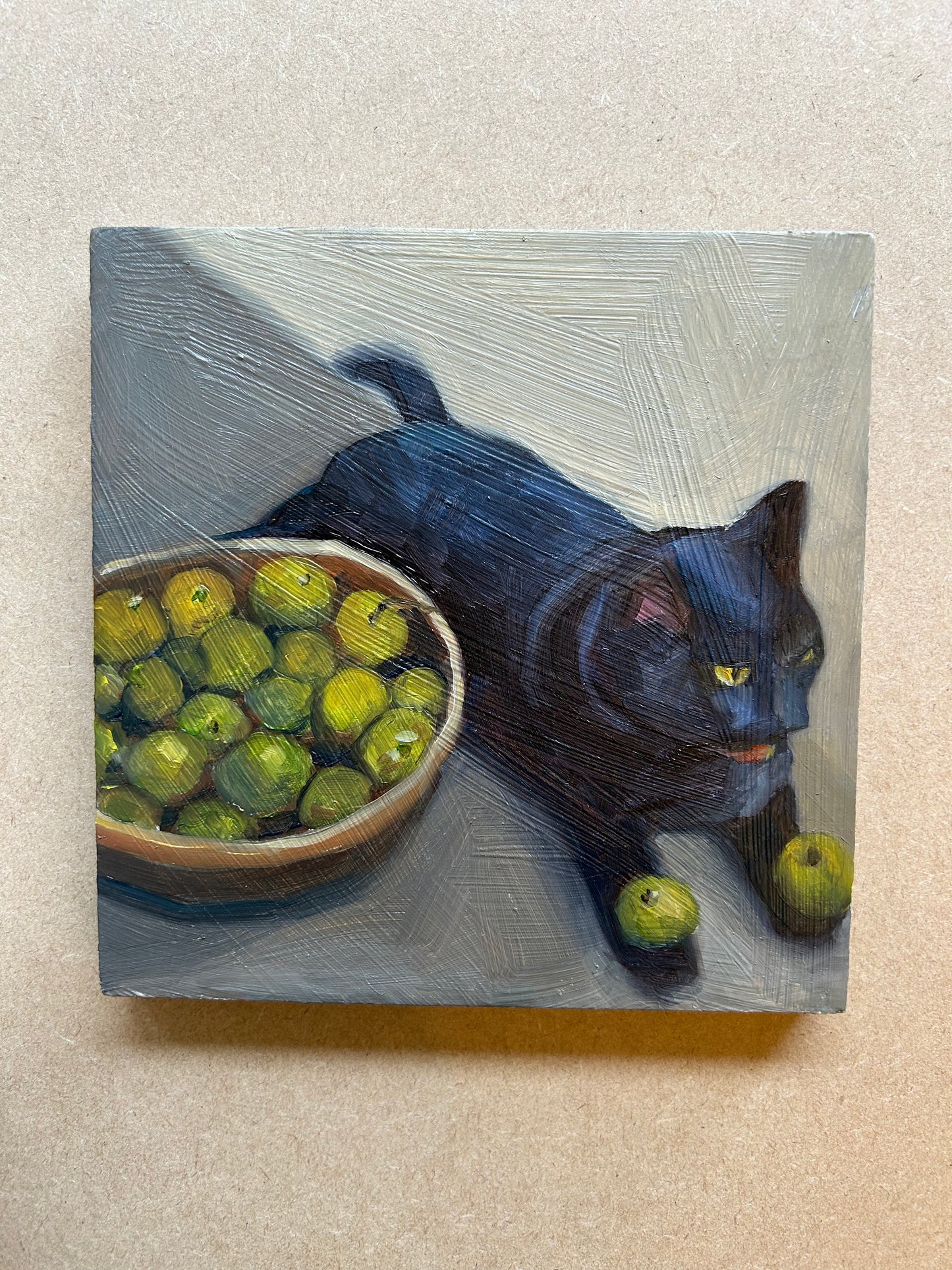 Black cat and green apples