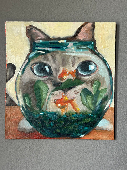Curious cat and a fishbowl
